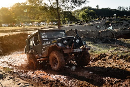 Jeep racing through the mud