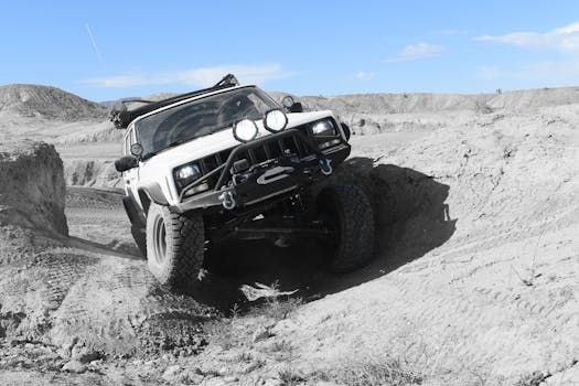 Jeep navigating rough terrain during WWII