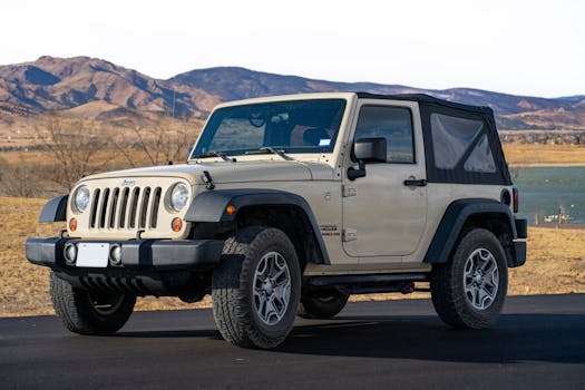 a Jeep Wrangler racing through rugged terrain